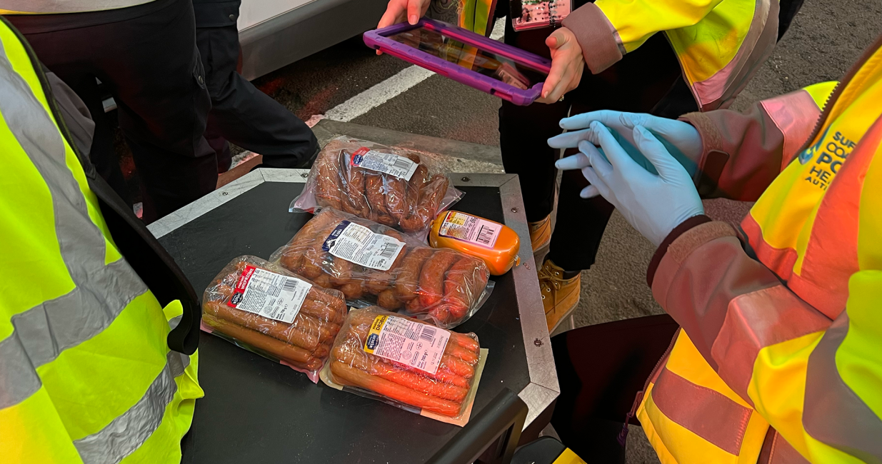 SCPHA team members examine pork products found in a van entering the port of Harwich