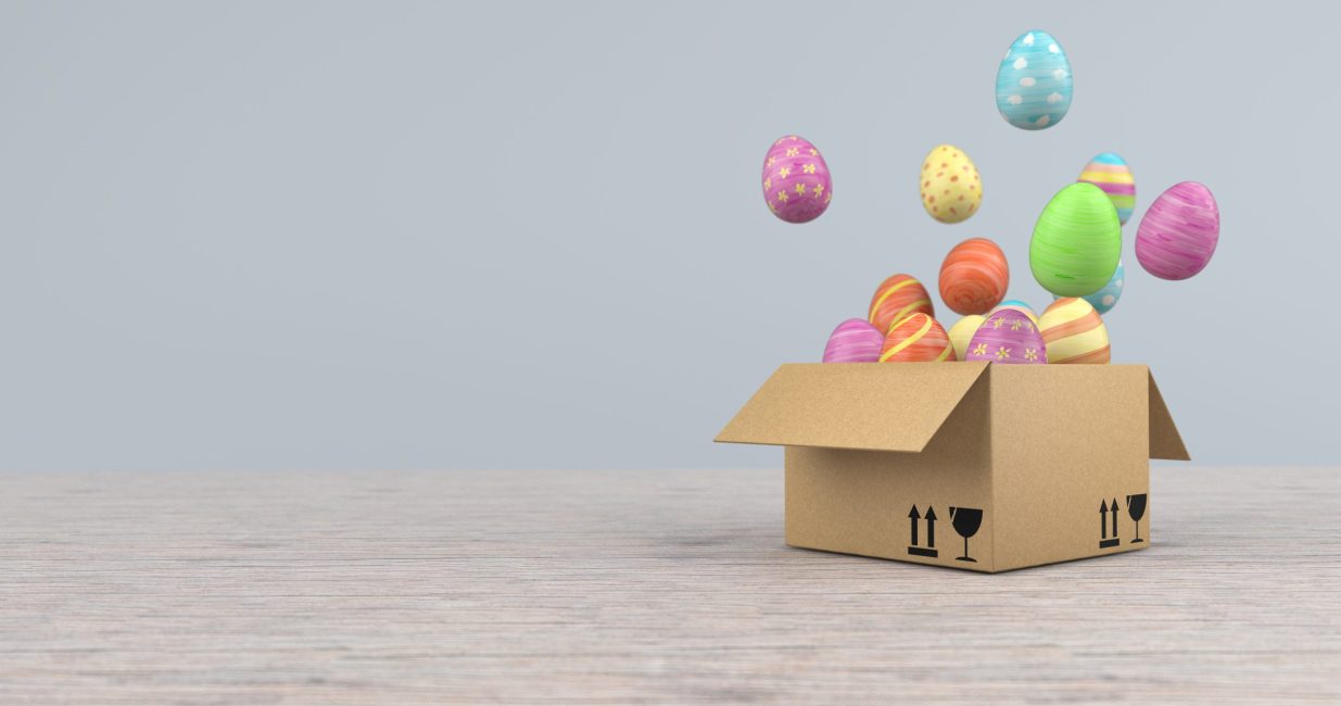A,Shipping,Carton,With,Colored,Easter,Eggs,On,The,Wooden