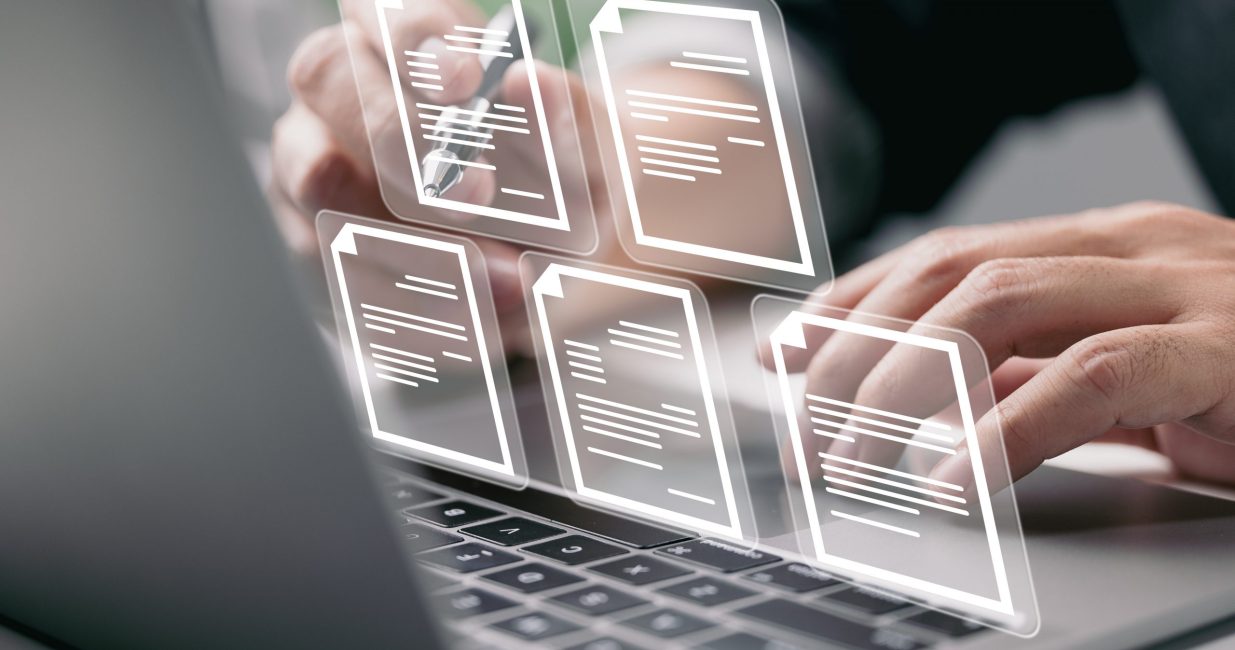 Businessman,Working,On,Laptop,Computer,With,Electronics,Document,Icons,,E-document